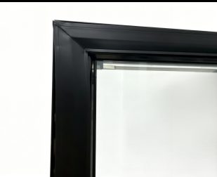 Refrigeration door frame with magnetic gasket installed