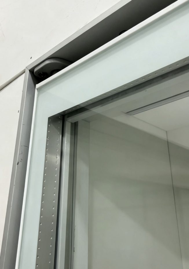 Frameless transparent-spacer glass door interior shelf view