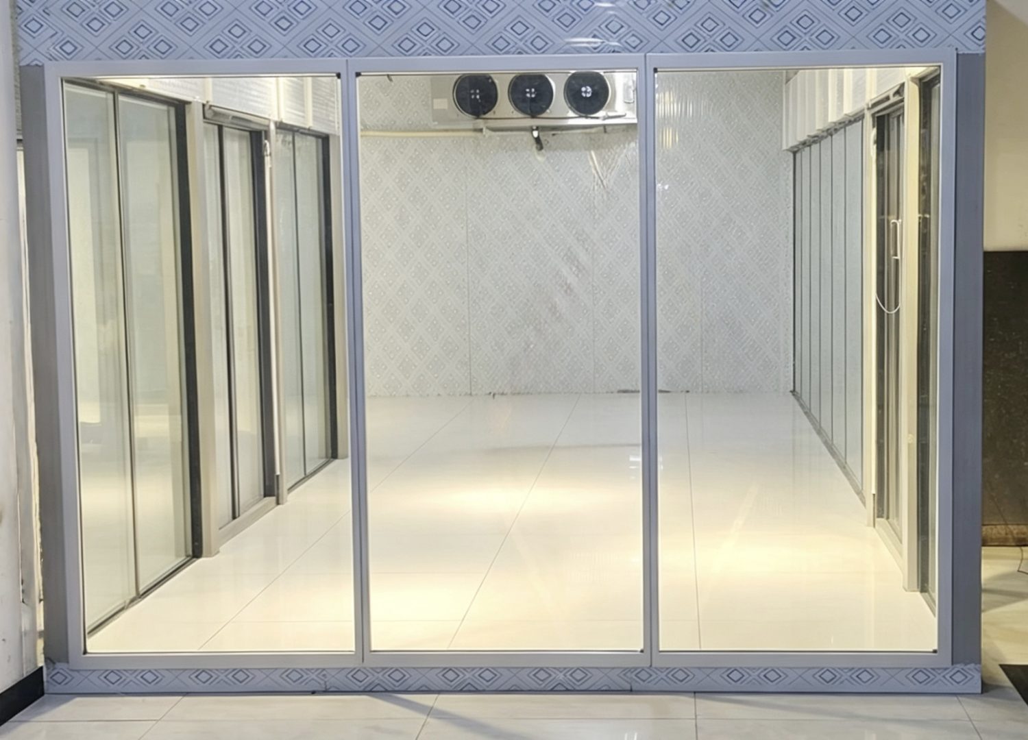 Walk-in cooler glass view doors with top-mounted units